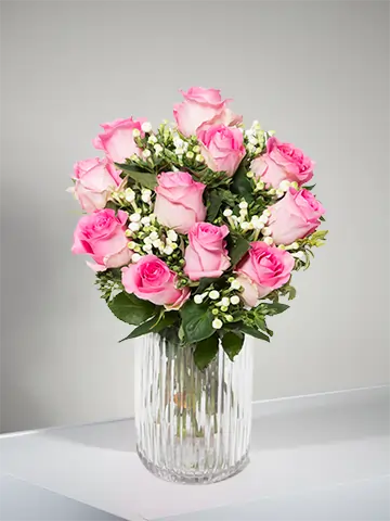 Bouquet di rose rosa e waxflower